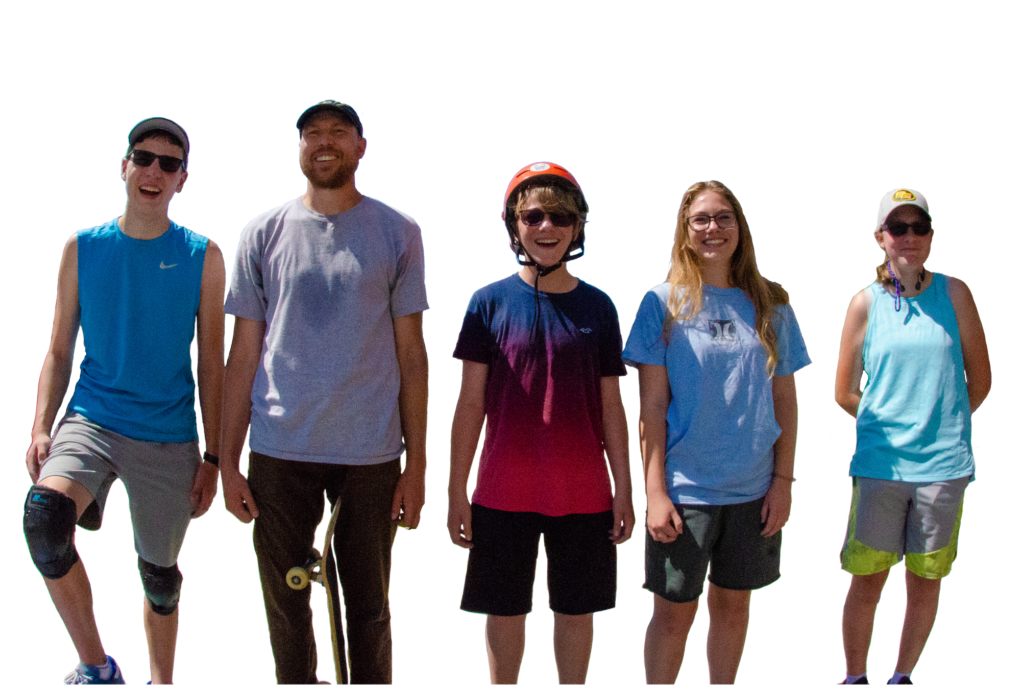 A photo of 5 low vision skate boarders standing and smiling. From the left. A smiling teenage boy with shades, in a blue shirt, grey shorts, with black knee pads. A smiling young man with a baseball cap, grey t-shirt, brown khakis with a skate board propped on his left leg. A smiling teenage boy, wearing a red helmet, shades, a t-shirt that fades from blue to magenta and black shorts. A smiling teenage girl with long light brown hair wearing a blue shirt and dark grey shorts. And last; a smirking teenage girl wearing a grey Edmonton Elks baseball cap, blue shirt and grey and green shorts.
